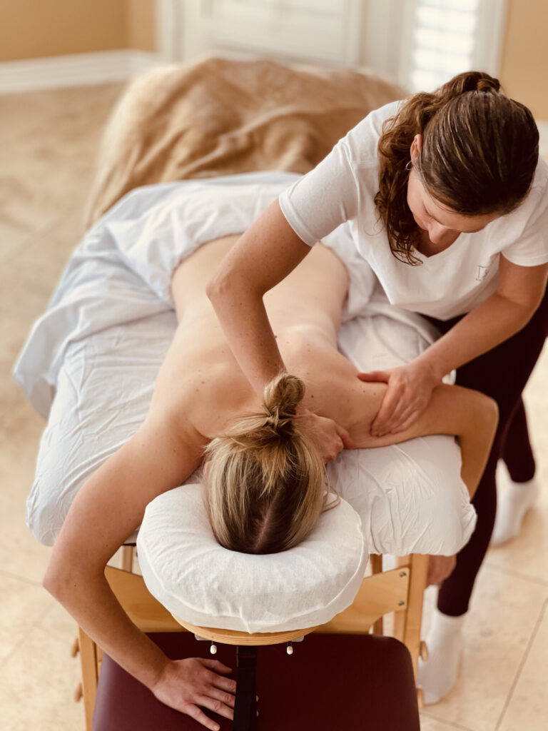 Client receiving massage in their home